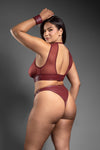 Burgundy faux leather cut-out lingerie set with crotchless panty, gold hardware, and cuffs.