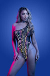 Black one-shoulder teddy with flash-reflective floral print, high-cut legs, and sheer mesh back that glows under light.