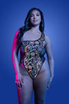 Black one-shoulder teddy with flash-reflective floral print, high-cut legs, and sheer mesh back that glows under light.