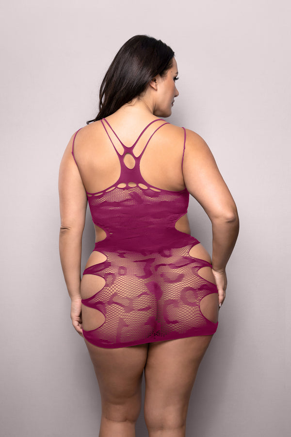 Magenta leopard mesh mini with cut-outs, illusion neckline, and racerback design for daring, sculpted impact.