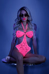 Striking IMPRESS ME neon pink lace bodysuit, showcasing its delicate lace front and captivating open cage back design, epitomizing radiant confidence.
