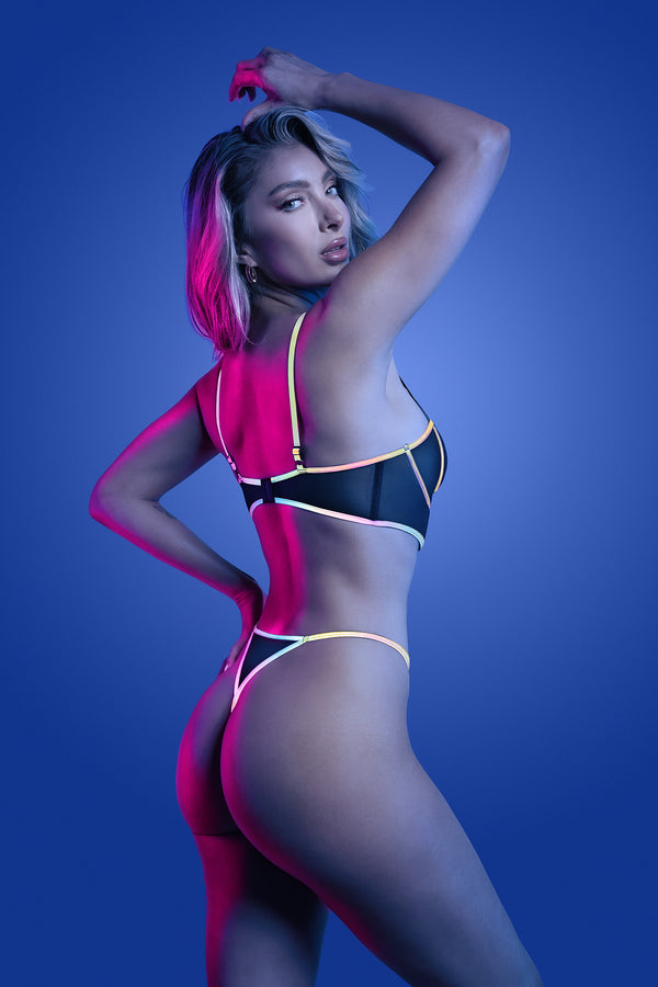 Black reflective lingerie set with underwire bra and strappy panty, featuring multicolor glow binding and sheer mesh panels.
