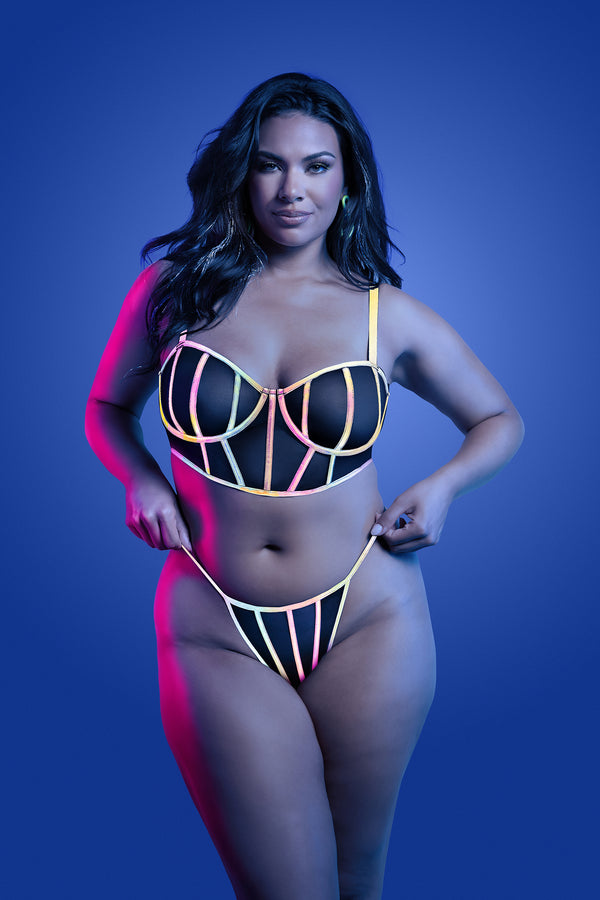 Black reflective lingerie set with underwire bra and strappy panty, featuring multicolor glow binding and sheer mesh panels.